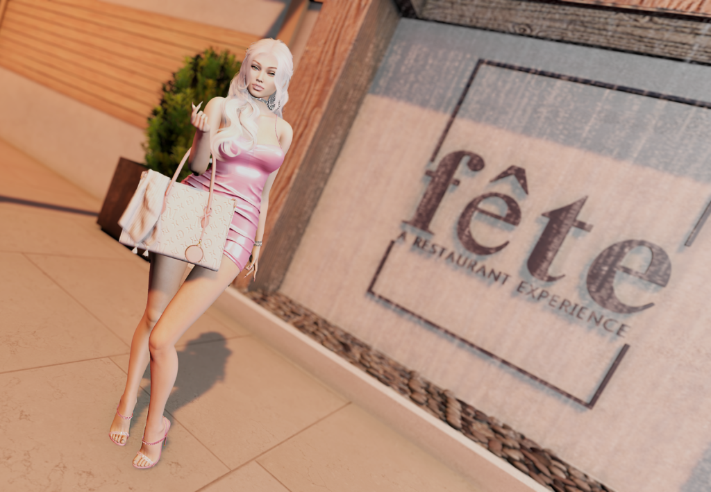 Fête Restaurant Experience, Harmony posed in front of the sign